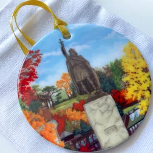 King Alfred Tree Ornament against it's white cotton pouch