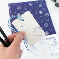 Explore by the Stars Wrapping Paper - Illustration by Jonathan Chapman