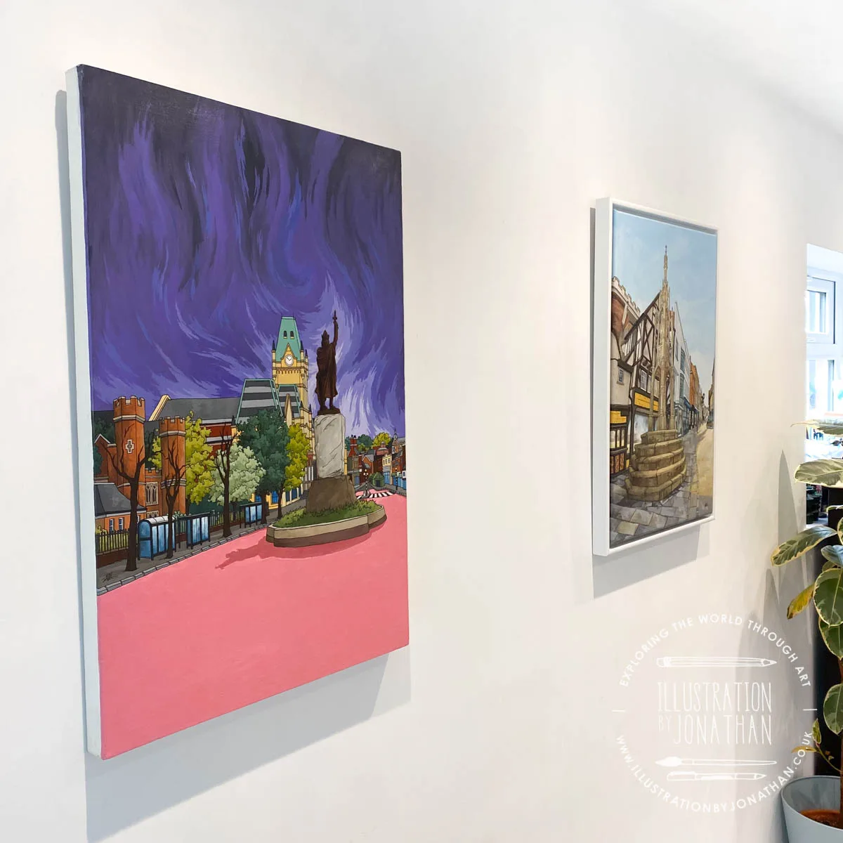 ‘Rainclouds Over the King’ and ‘Sun on the High Street’ on display in the Chapman Gallery. Art and Illustration by Jonathan Chapman